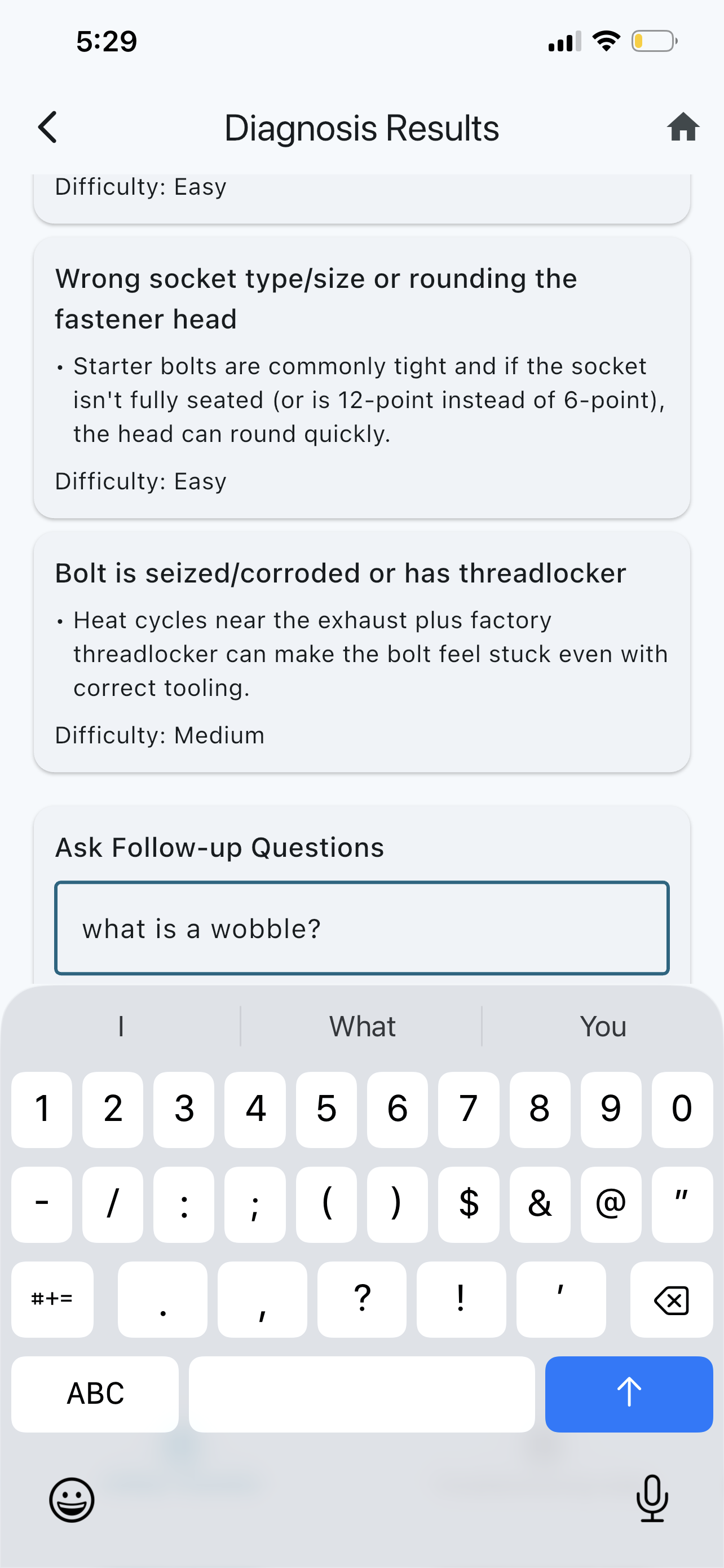 Pocket AI Mechanic follow-up question entry asking what a wobble is